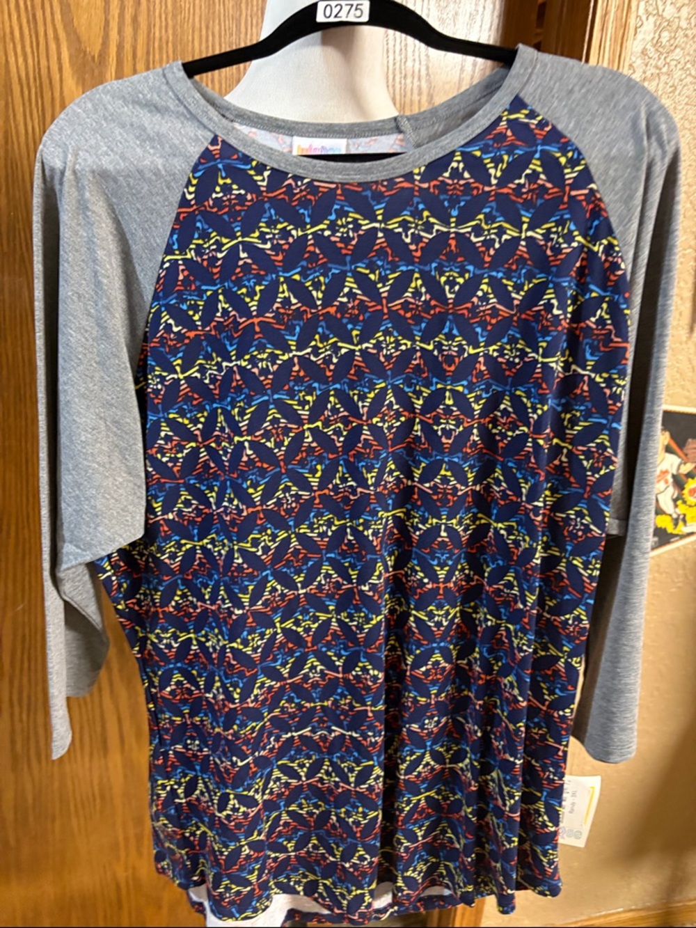 LuLaRoe Kids Navy Raglan Tee with Gray Sleeves and Bright Geometric Print